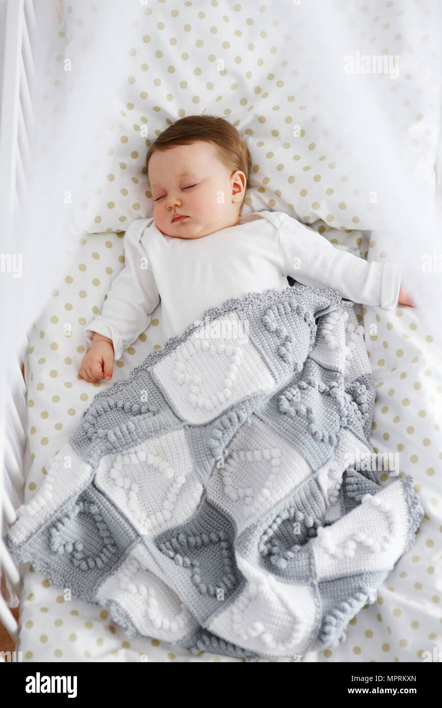 Baby sleeping in the crib Stock Photo Alamy