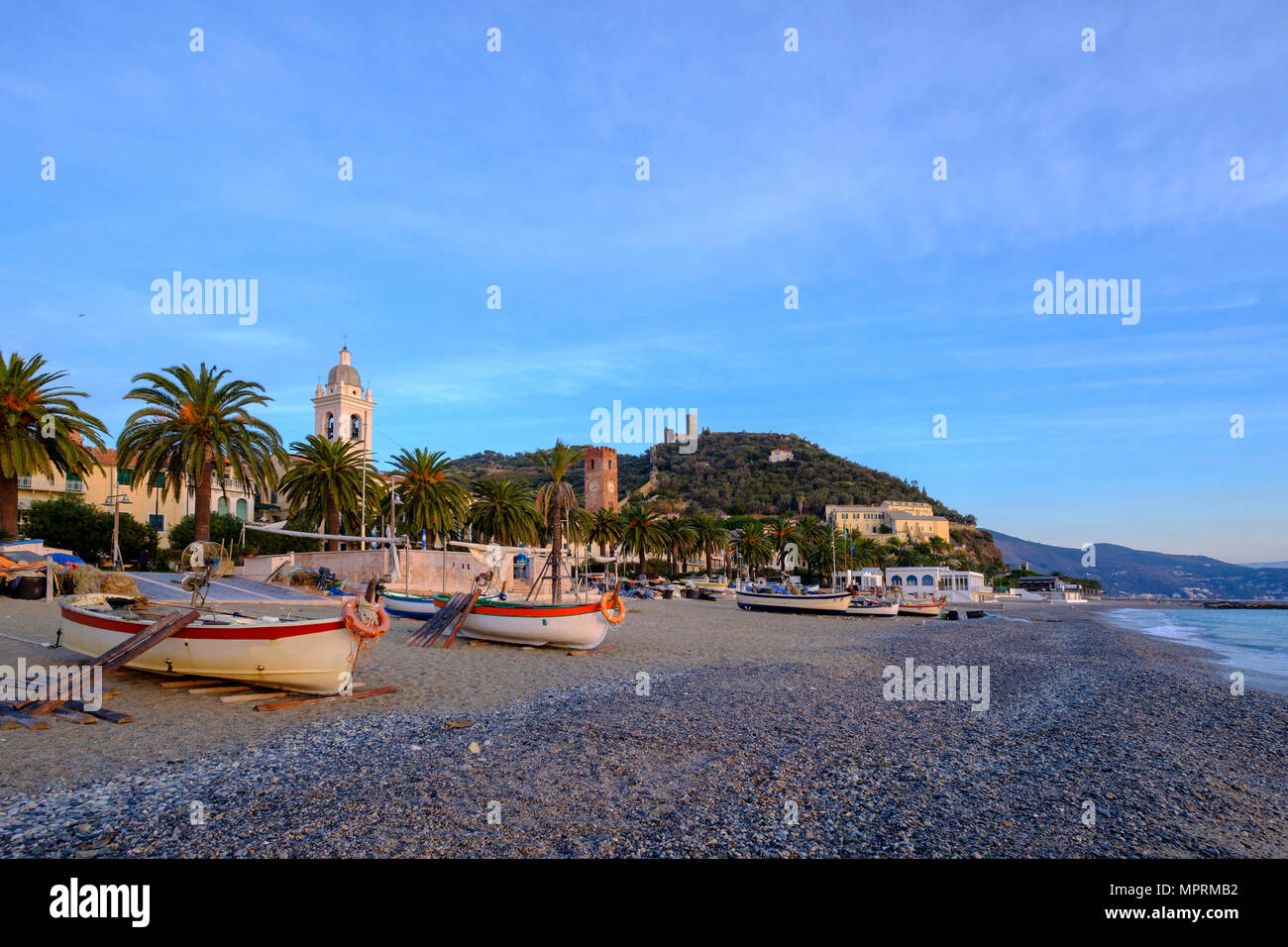Italy, Liguria, Riviera di Ponente, Noli, fishing boats at beach in the morning light Stock Photo