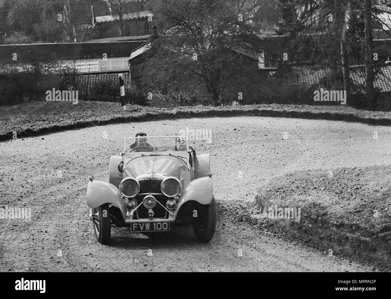 Jaguar SS 100 of CJ Gibson competing in the RAC Rally, 1939. Artist: Bill Brunell. Stock Photo