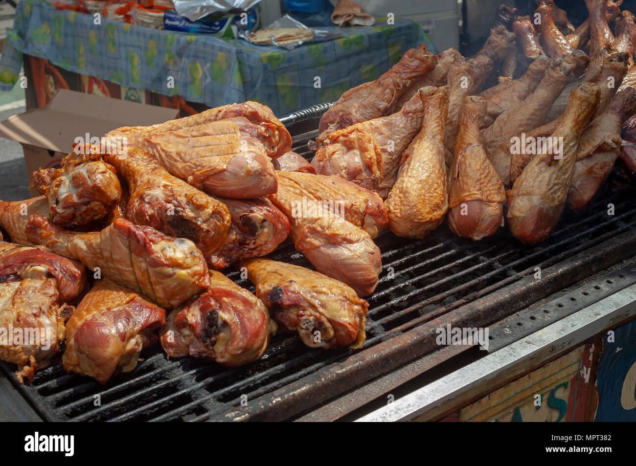 Gigantic turkey drumsticks grilling at a kiosk at the 45th Annual Ninth Avenue International Food Festival in New York on Sunday, May 20, 2018. (Â© Richard B. Levine) Stock Photo