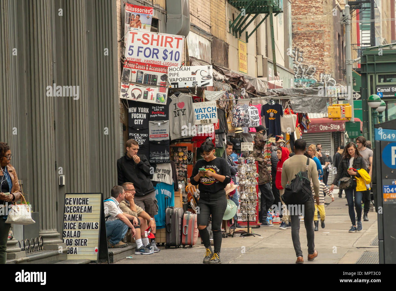 Merchants on Canal Street in New York on Thursday, May 17, 2018. Despite  the ubiquitous merchants selling schlock and counterfeit products the area  around Canal Street is reported to be undergoing a