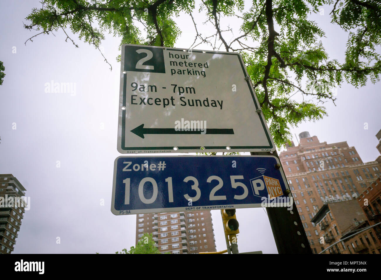 Street signs in the Chelsea neighborhood of New York  inform motorists of the time limitations at the metered parking spots on Thursday, May 17, 2018. The New York Dept. of Transportation announced today that metered parking rates will rise by the end of the year. (Â© Richard B. Levine) Stock Photo