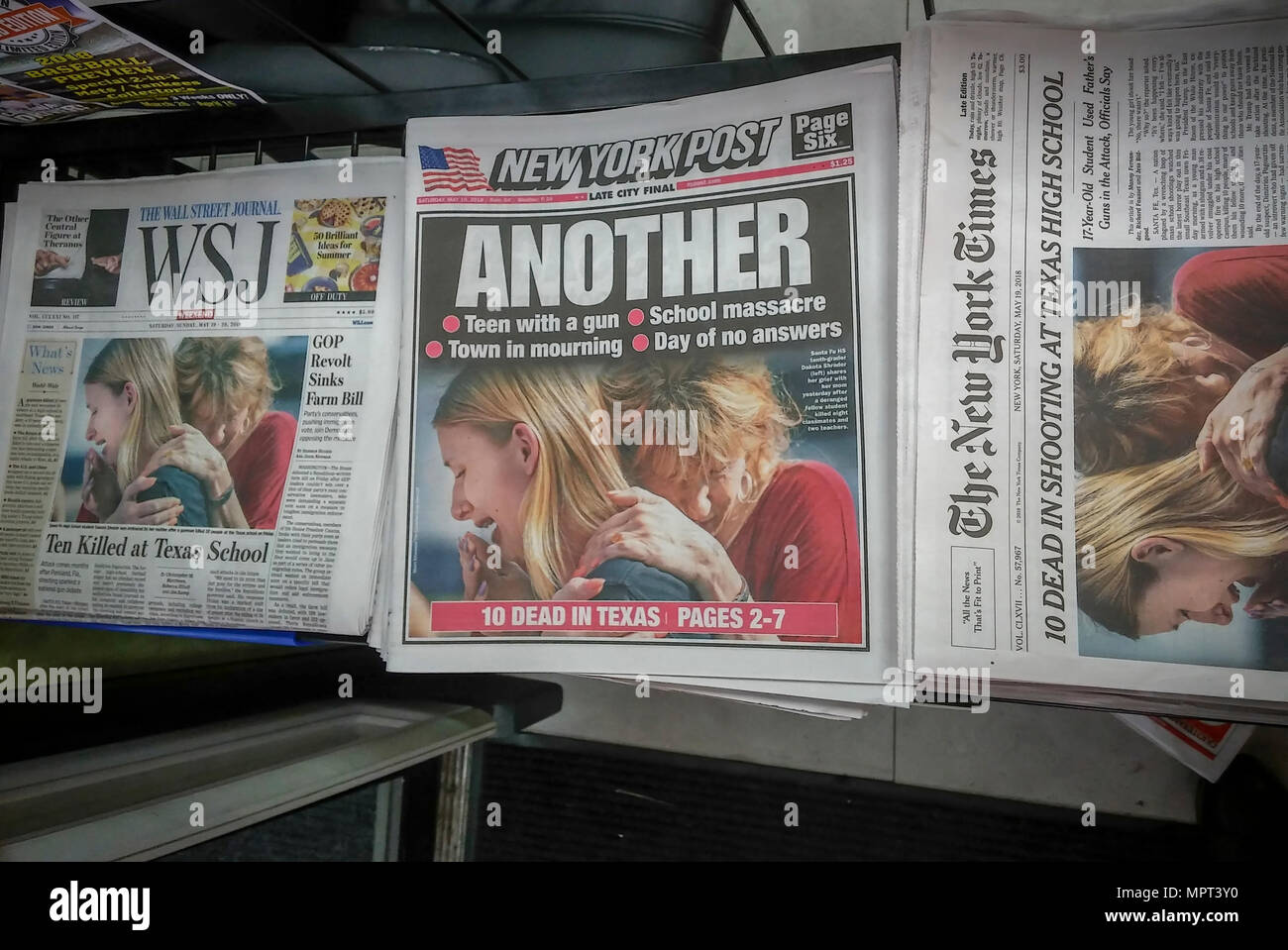 Front pages of New York newspapers use the same photograph on Saturday, May 19, 2018 reporting on the previous days' shooting at Santa Fe High School in Texas where eight students and two teachers were killed by 17 year old student Dimitrios Pagourtzis. (Â© Richard B. Levine) Stock Photo