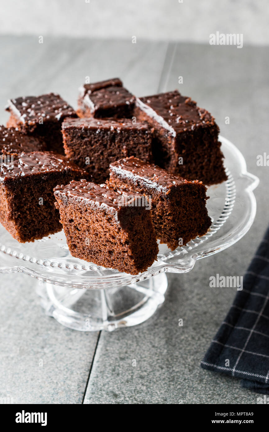 Free Photo | Moist chocolate sponge cake brownie on wooden plate on marble  table.