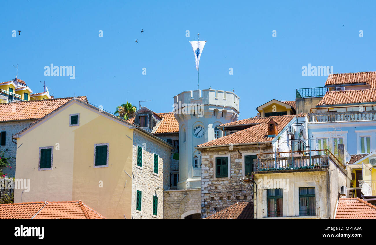 Herceg Novi, Montenegro - July 8, 2015: Old town gate with the small clocktower surrounded by old houses Stock Photo