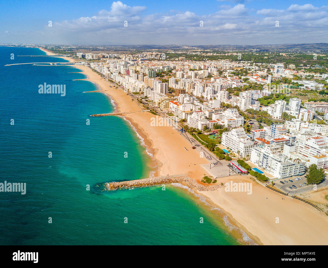 Aerial view, wide sandy beach in touristic resorts of Quarteira and Vilamoura, Algarve, Portugal Stock Photo