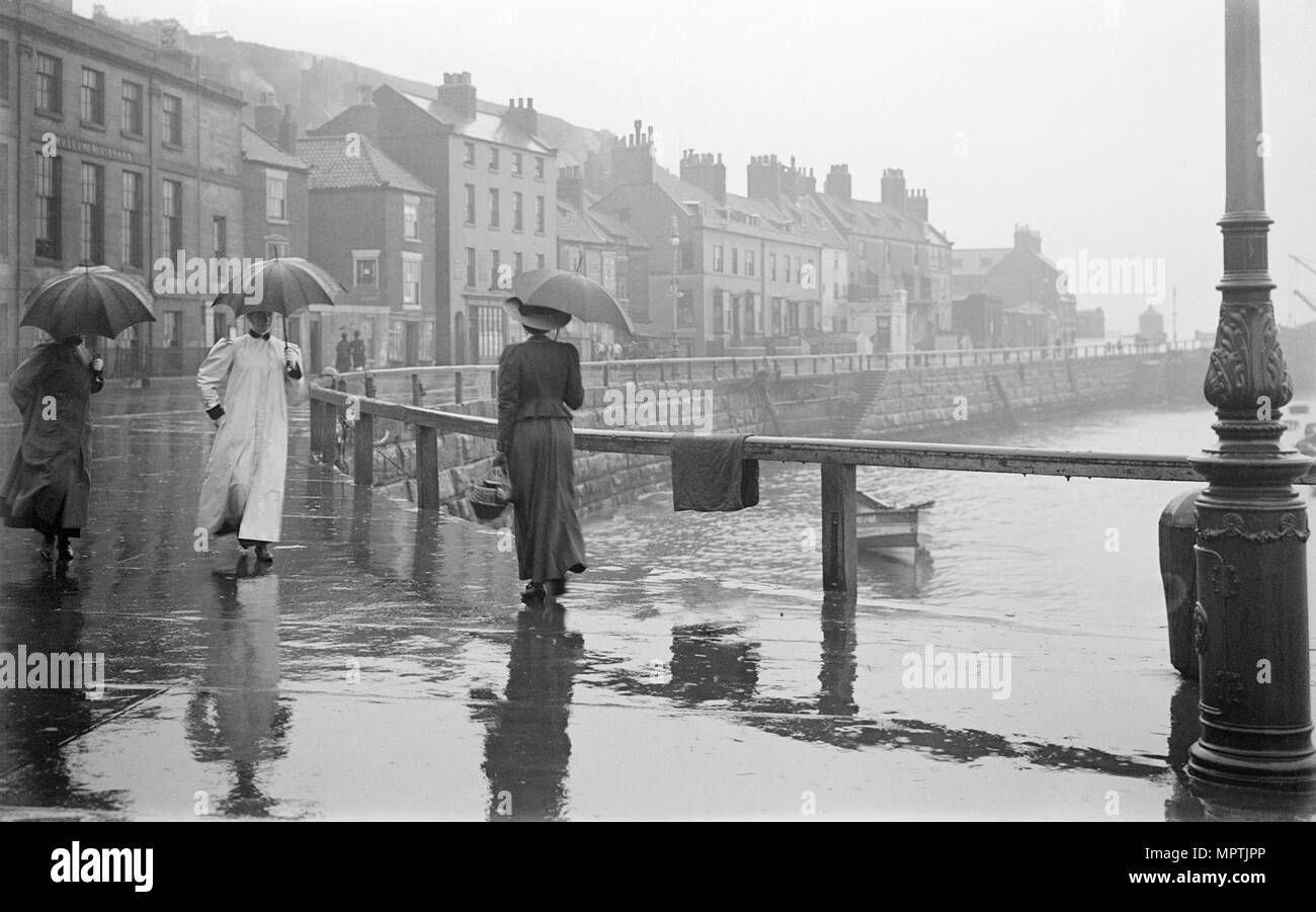 A rainy day on Pier Road, Whitby, North Yorkshire, 1896-1920