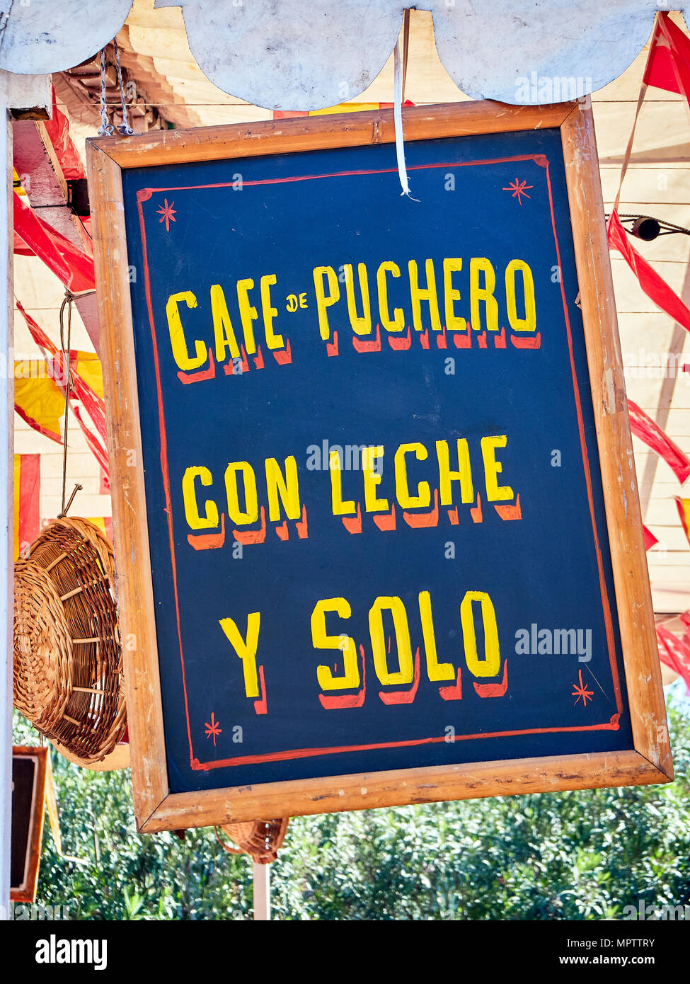 Vintage wooden signboard at a fair announcing coffee in Spanish; Pout coffee, Coffee with milk and Black coffee. Stock Photo
