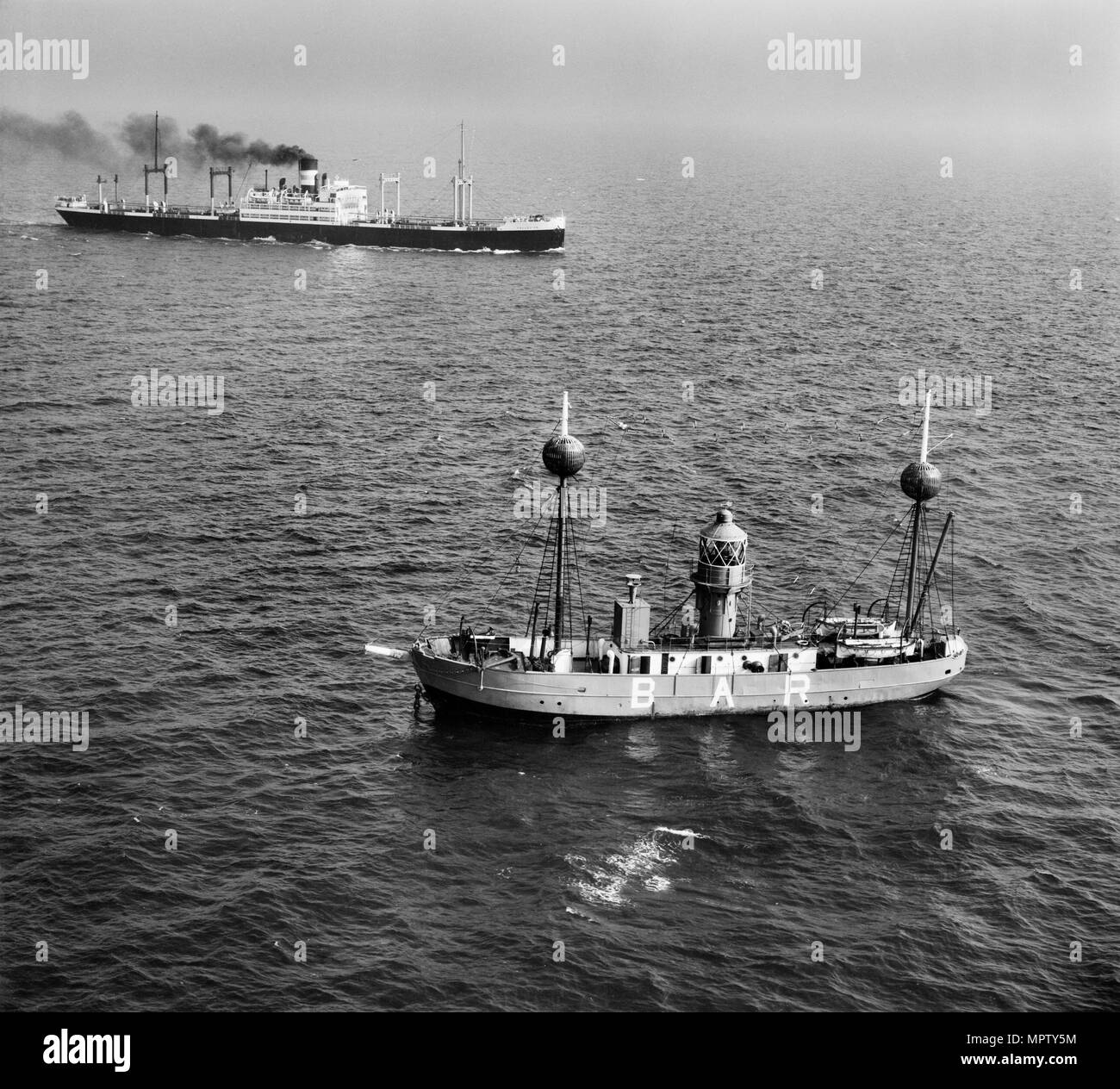 The Alarm (Mersey Bar Lightship) and SS 'Collegian', Liverpool Bay, Wirral, 1948. Artist: Aerofilms. Stock Photo