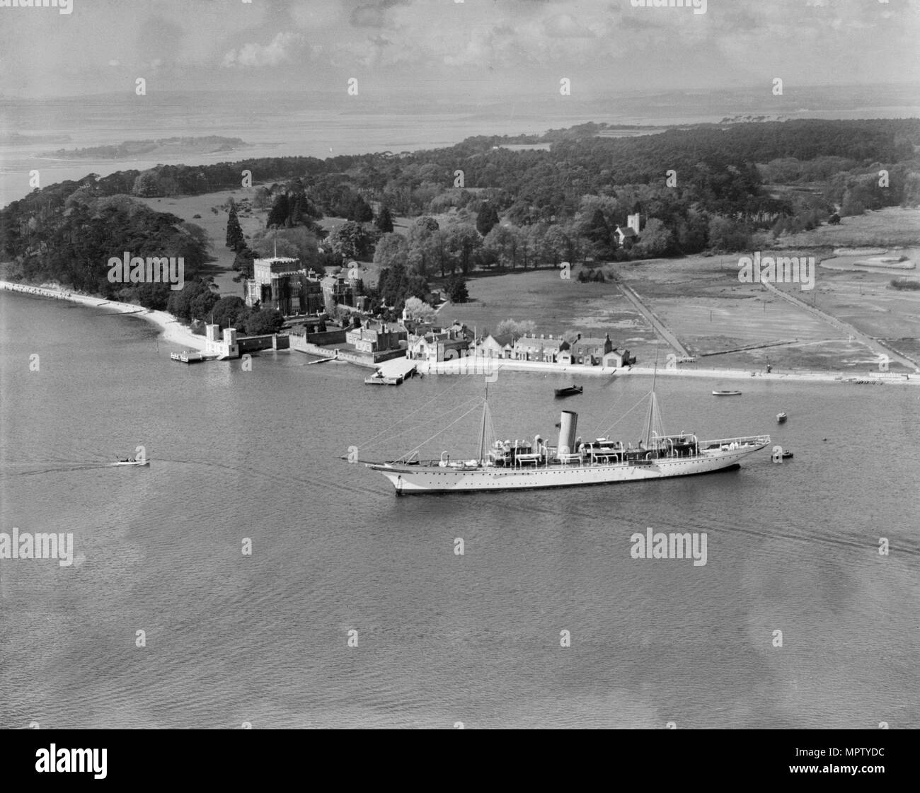 Montague Grahame-White's steam yacht 'Alacrity' and Brownsea Island, Dorset, from the east, 1933. Artist: Aerofilms. Stock Photo