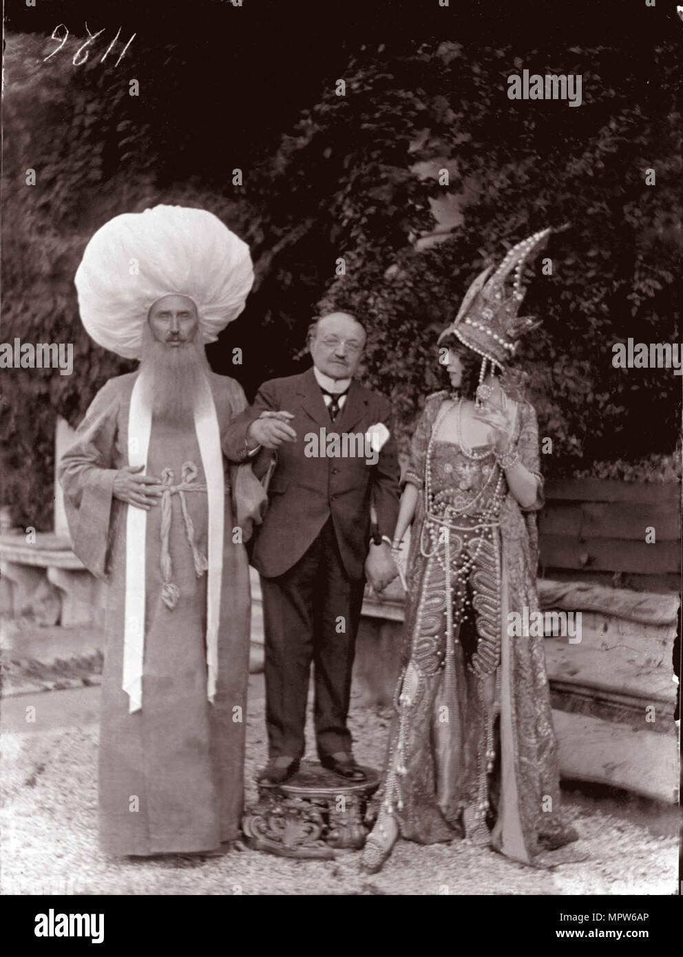 The Marchesa Casati by Giovanni Boldini and a man in a mask, 1913. Stock Photo