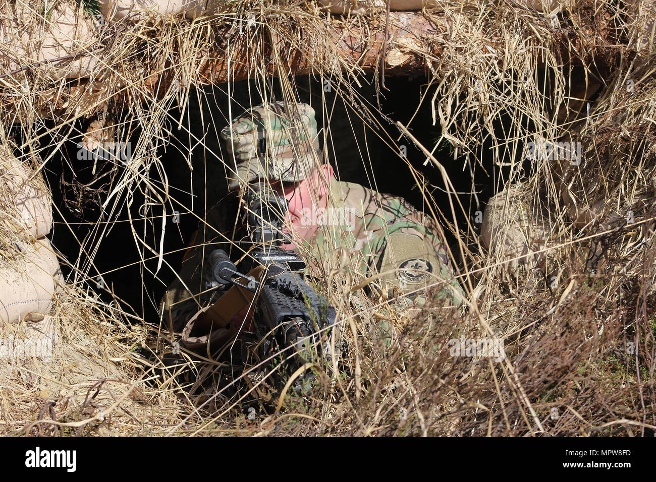 1st Lt. Matthew Medlin demonstrates proper machine gun placement in