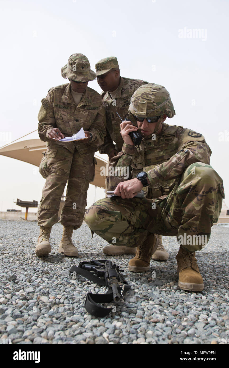 Sgt. Brett Jones, with the 300th Sustainment Brigade, calls in a Spot Report during the 1st Sustainment Command (Theater) Best Warrior Competition at Camp Arifjan, Kuwait, April 15, 2017. (U.S. Army Photo by Staff Sgt. Dalton Smith) Stock Photo