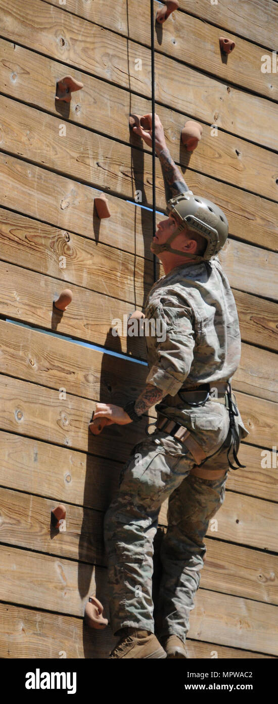 Staff Sgt. Luke Katz scales a rock wall tower during the day stakes portion of the Best Ranger Competition at Fort Benning, Ga. The competition was held April 7-9. Katz, a member of the Nebraska Army National Guard, finished the competition in 10th place, improving on his 17th place finish the previous year. (Nebraska National Guard Stock Photo