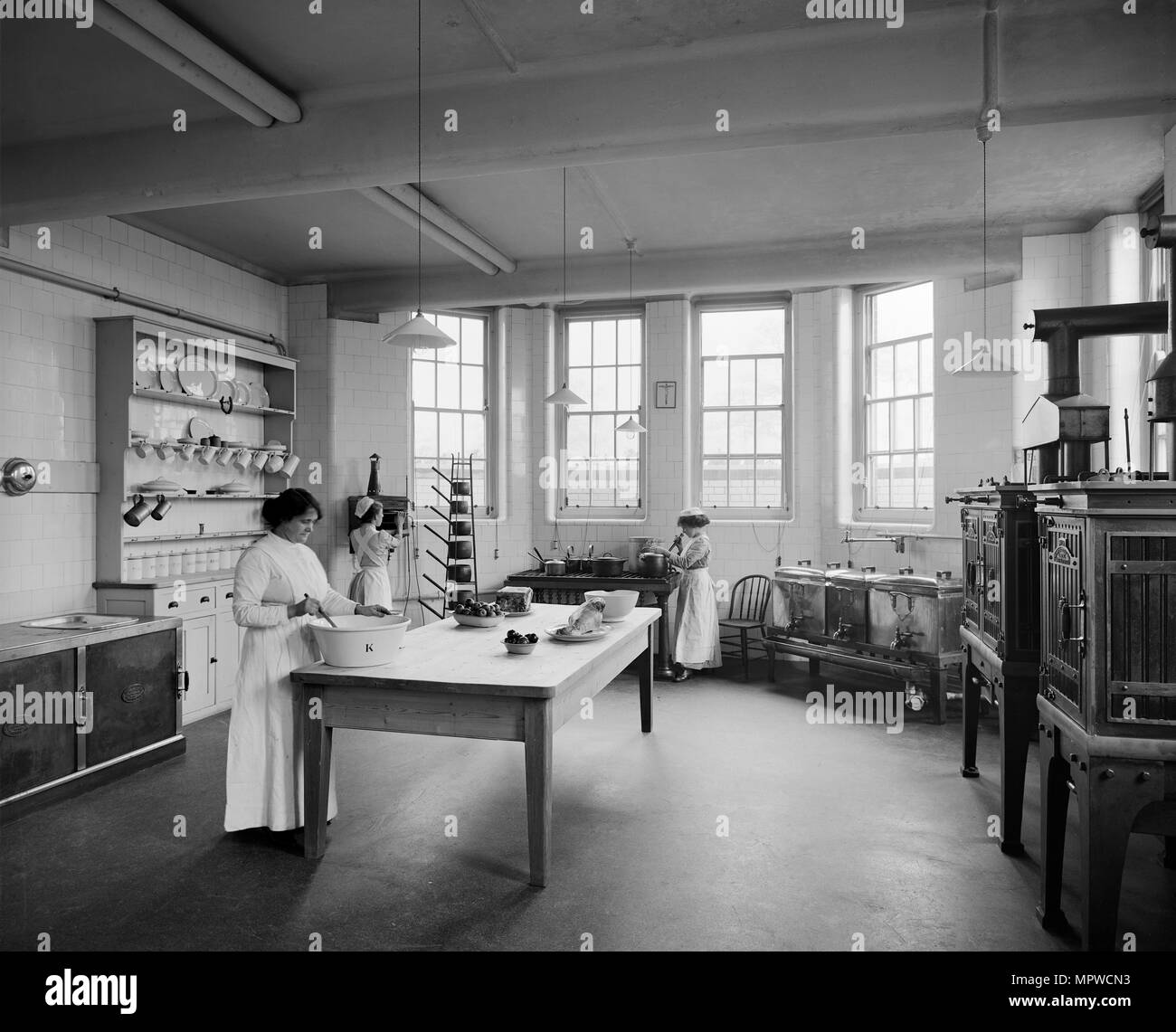 Kitchen, St Andrew's Hospital, Dollis Hill, London, 1914. Artist: Adolph Augustus Boucher. Stock Photo