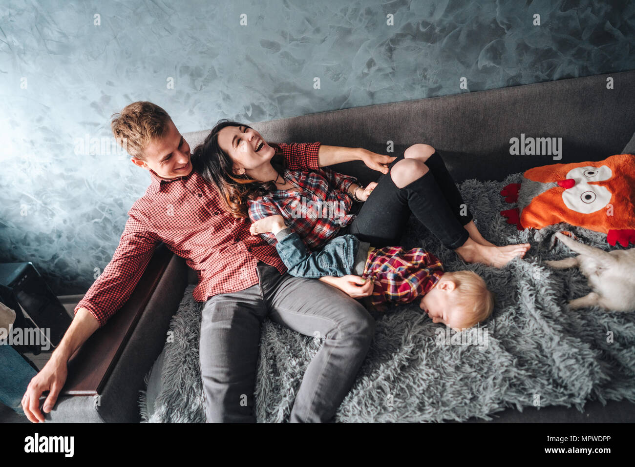 Happy family on the couch Stock Photo