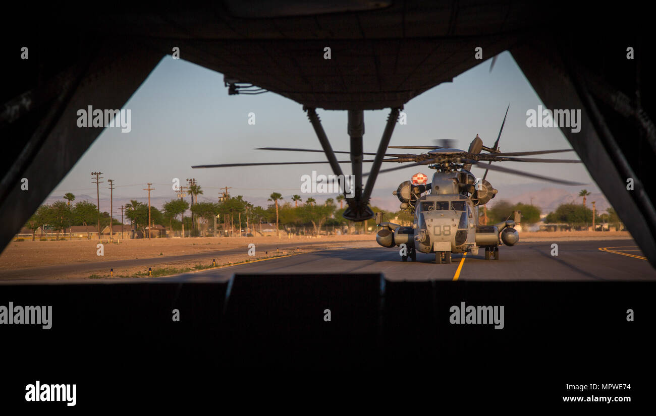 A CH-53E Super Stallion assigned to Marine Heavy Helicopter Squadron (HMH) 466 taxis down a flight line before transporting Marines during an exercise in part of Weapons and Tactics Instructors course (WTI) 2-17 at El Centro, Calif., April 20, 2017. WTI is held biannually at Marine Corps Air Station (MCAS) Yuma, Ariz., to provide students with detailed training on the various ranges in Arizona and California. (U.S. Marine Corps photo by Cpl. Trever A. Statz/Released) Stock Photo