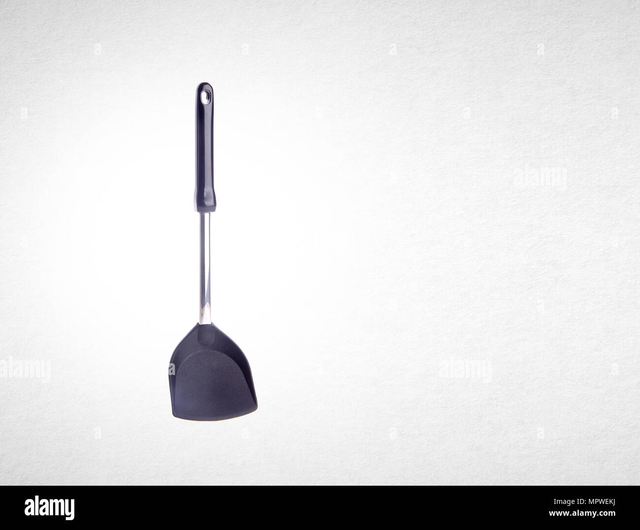 kitchen utensils or spade of frying pan on background Stock Photo ...