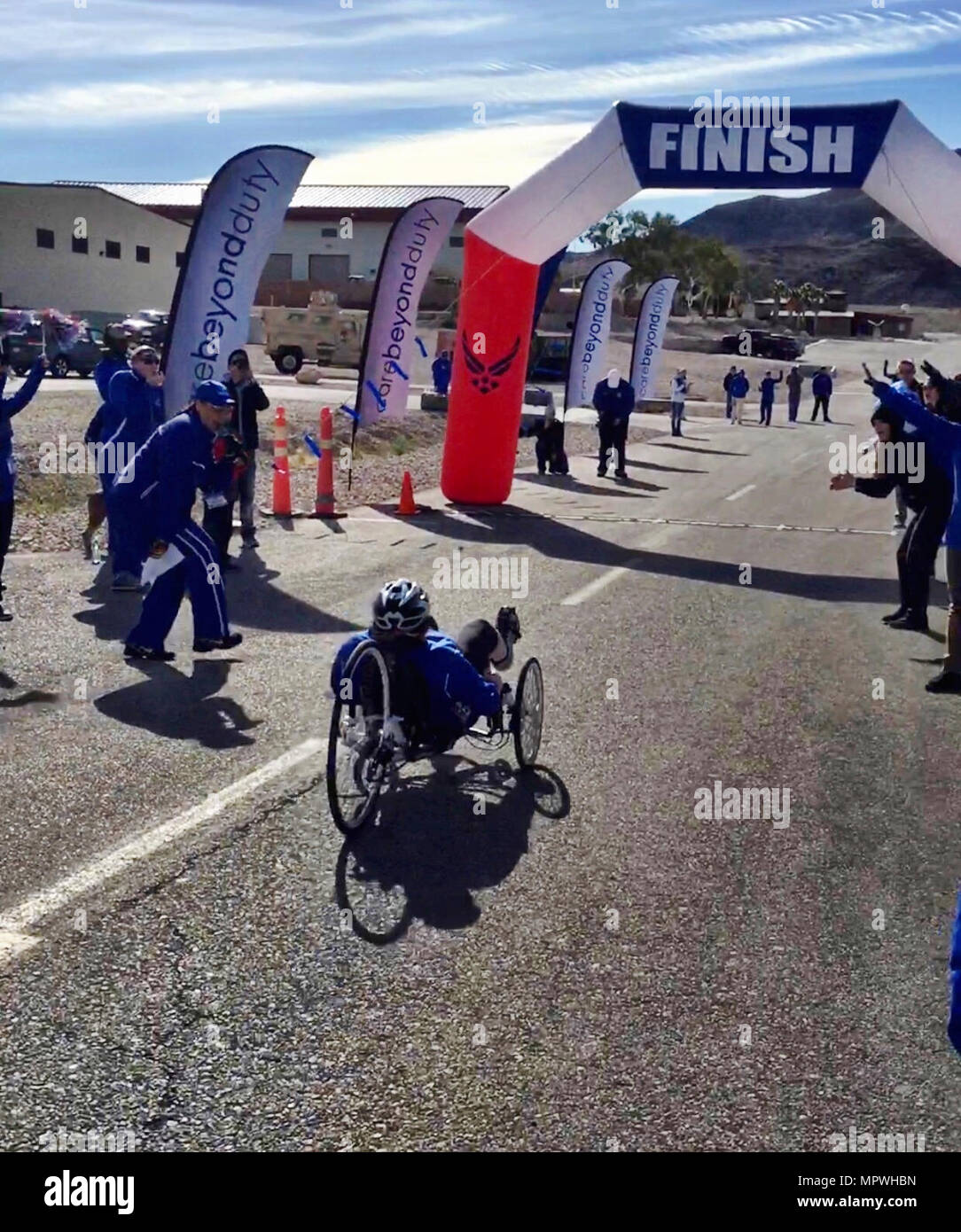 Lt Col Jackie Burns, 552d Air Control Group, 552d Air Control Wing, prepares to cross the finish line on her way to earning a Silver Medal in Cycling on a recumbent bike. This event took place at the Wounded Warrior Trials held February 17, 2017, at Nellis Air Force Base, Nevada.  Burns was selected to the primary Air Force team which will compete at the Warrior Games June 30 - July 8, 2017 in Chicago.  (Air Force Stock Photo