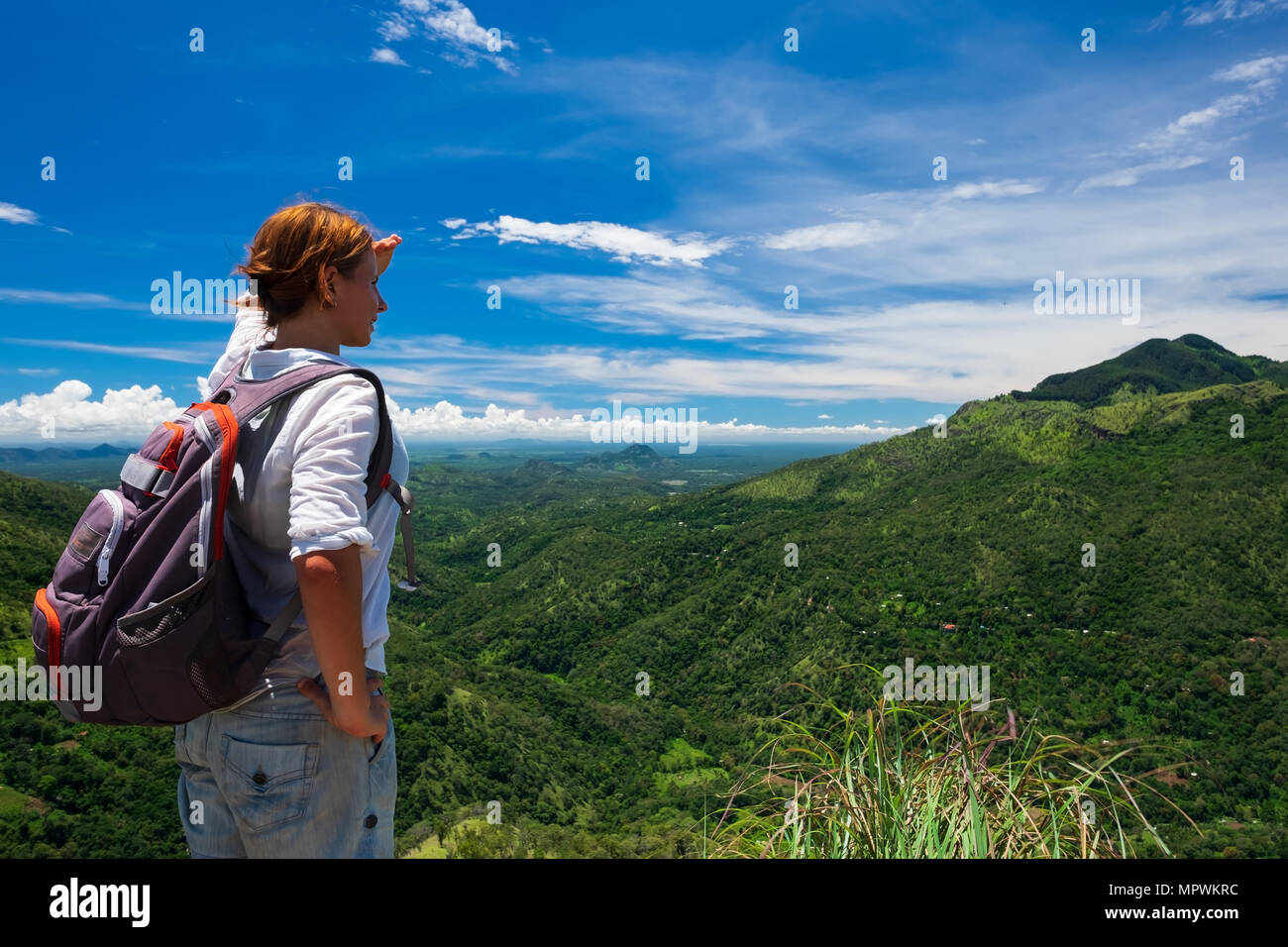 Woman standing edge cliff hi-res stock photography and images - Alamy