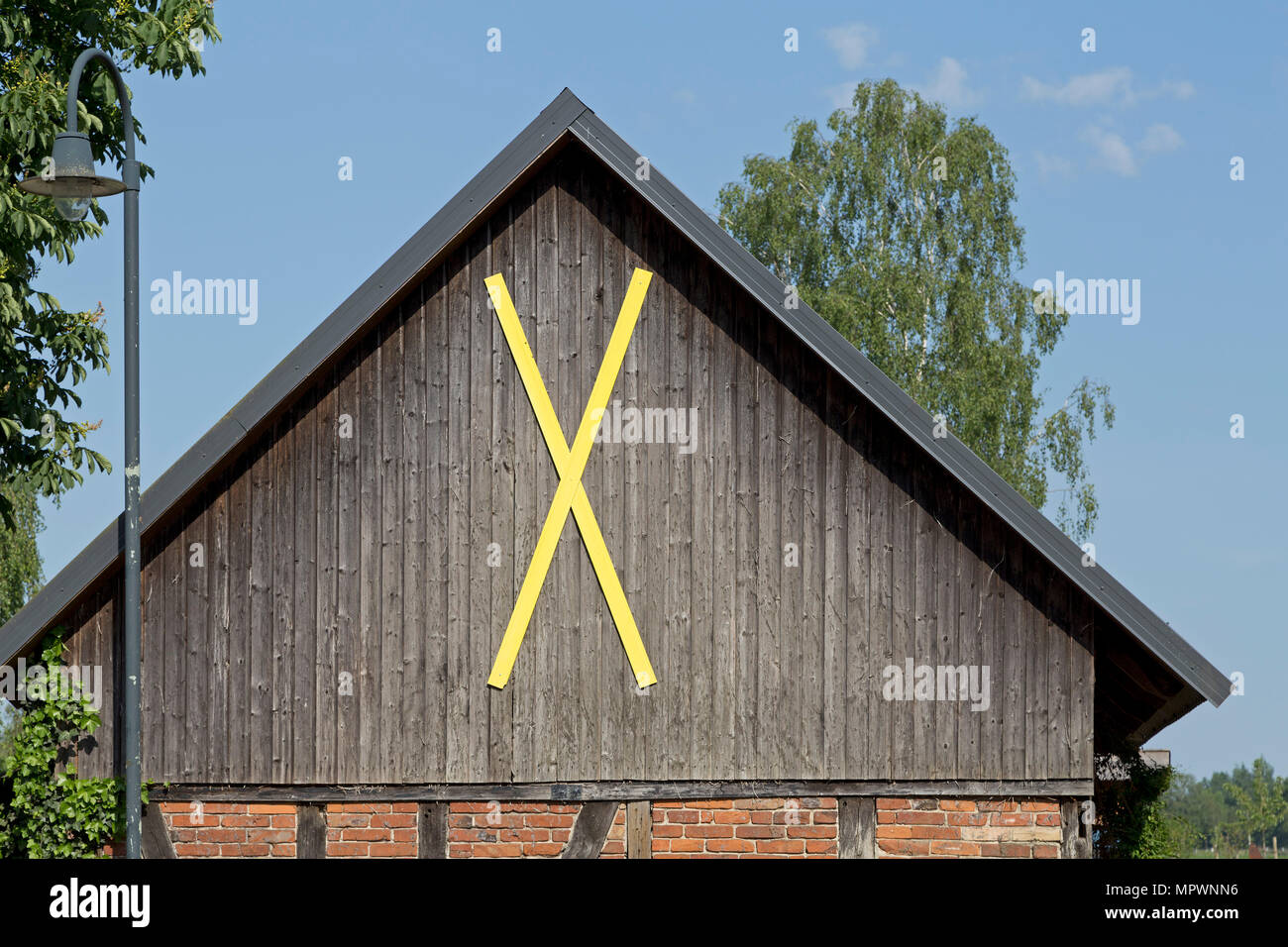 Castor Cross on a barn, Pannecke, Wendland, Lower Saxony, Germany Stock Photo