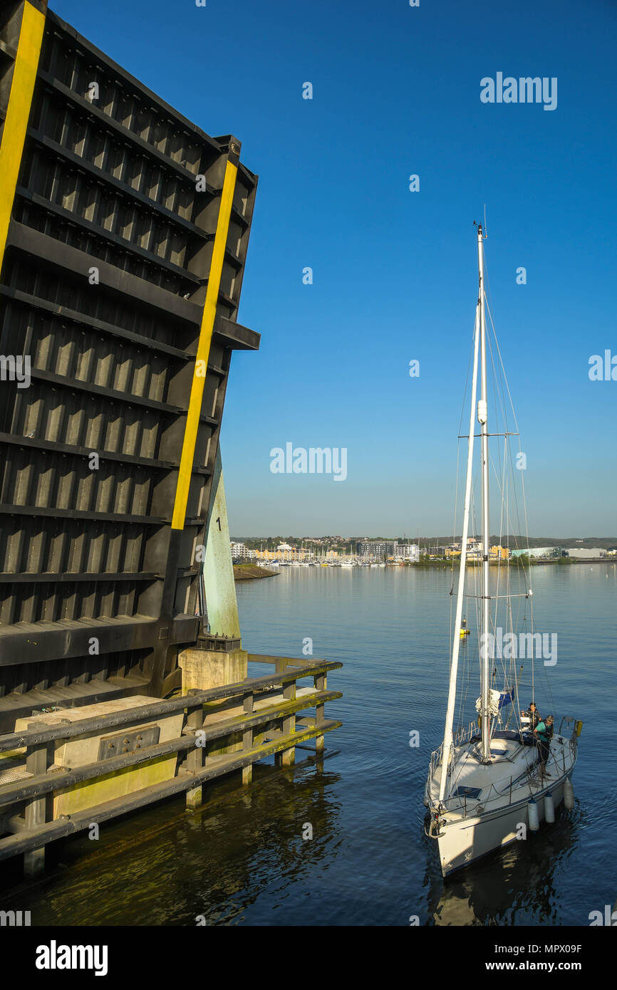 One of the road bridges on the Cardiff Bay barrage in the raised position. The bridge lifted to allow the sailing boat to pass into the lock Stock Photo