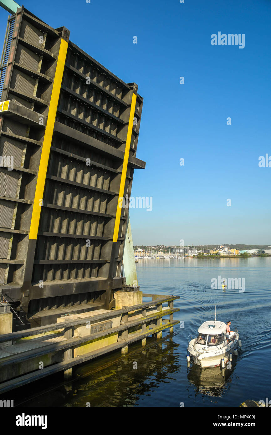 One of the road bridges on the Cardiff Bay barrage in the raised position. The bridge lifted to allow the boat to pass into the lock Stock Photo