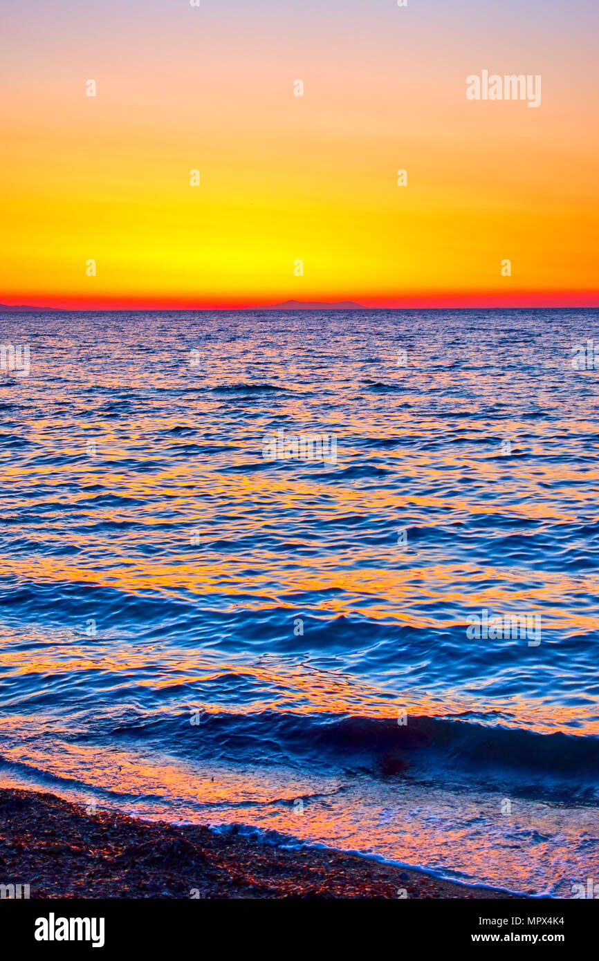Sky and sea water surface at sundown - Sunset seascape Stock Photo