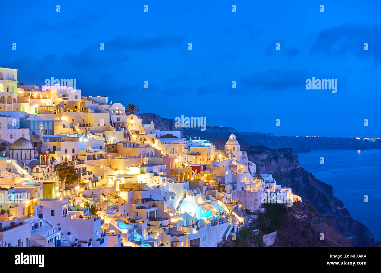 View of Thira town at night, Santorini Island, Greece Stock Photo