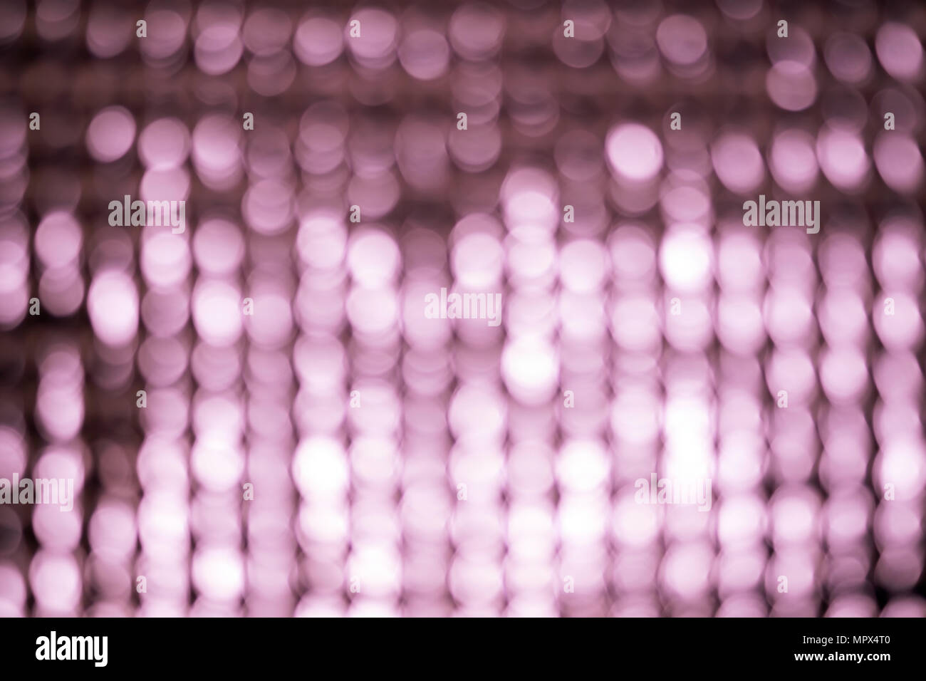 Abstract blur background of aluminum foil. Pink tone. Stock Photo