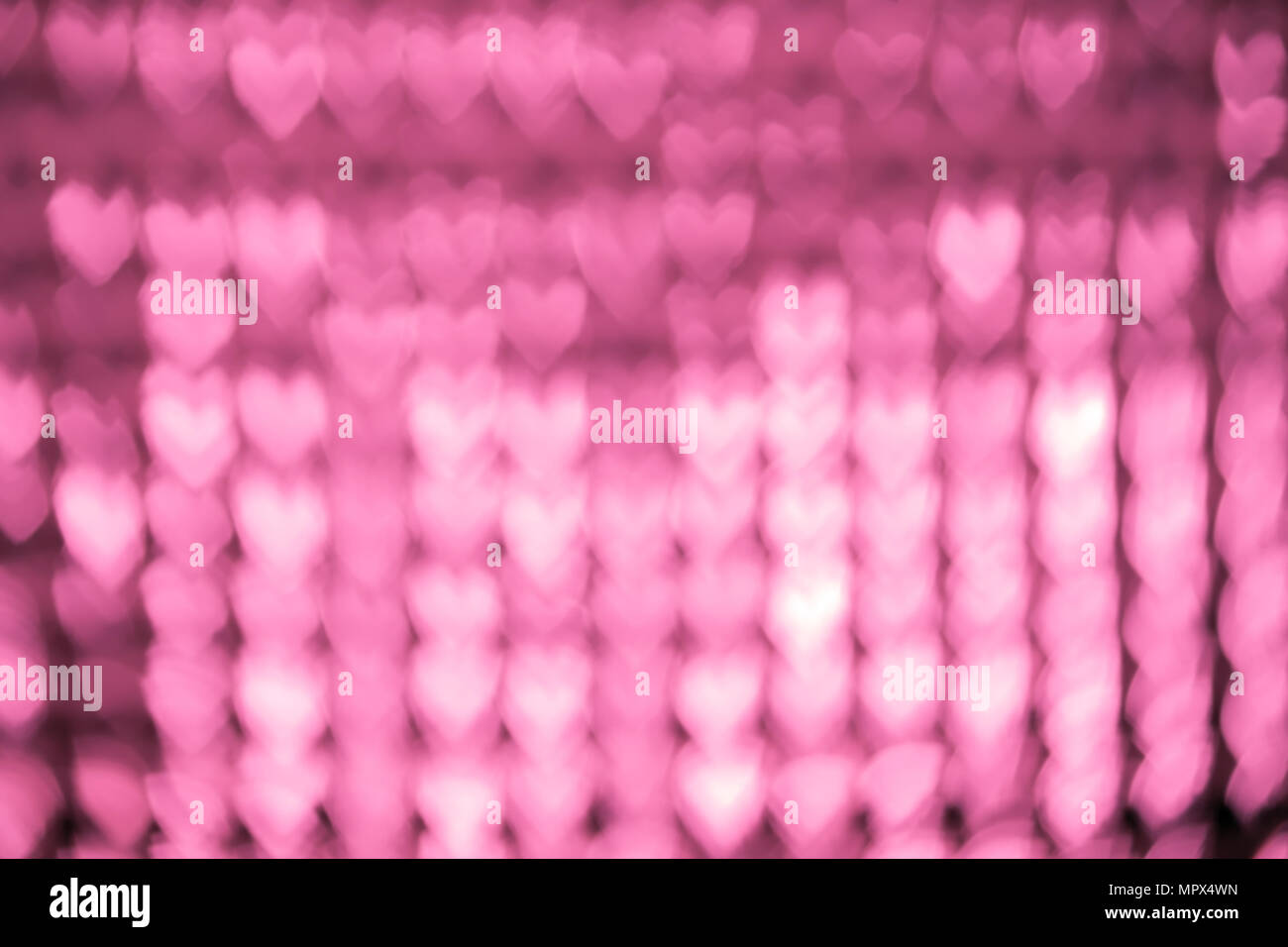 Abstract blur background with heart shaped. Pink tone. Stock Photo