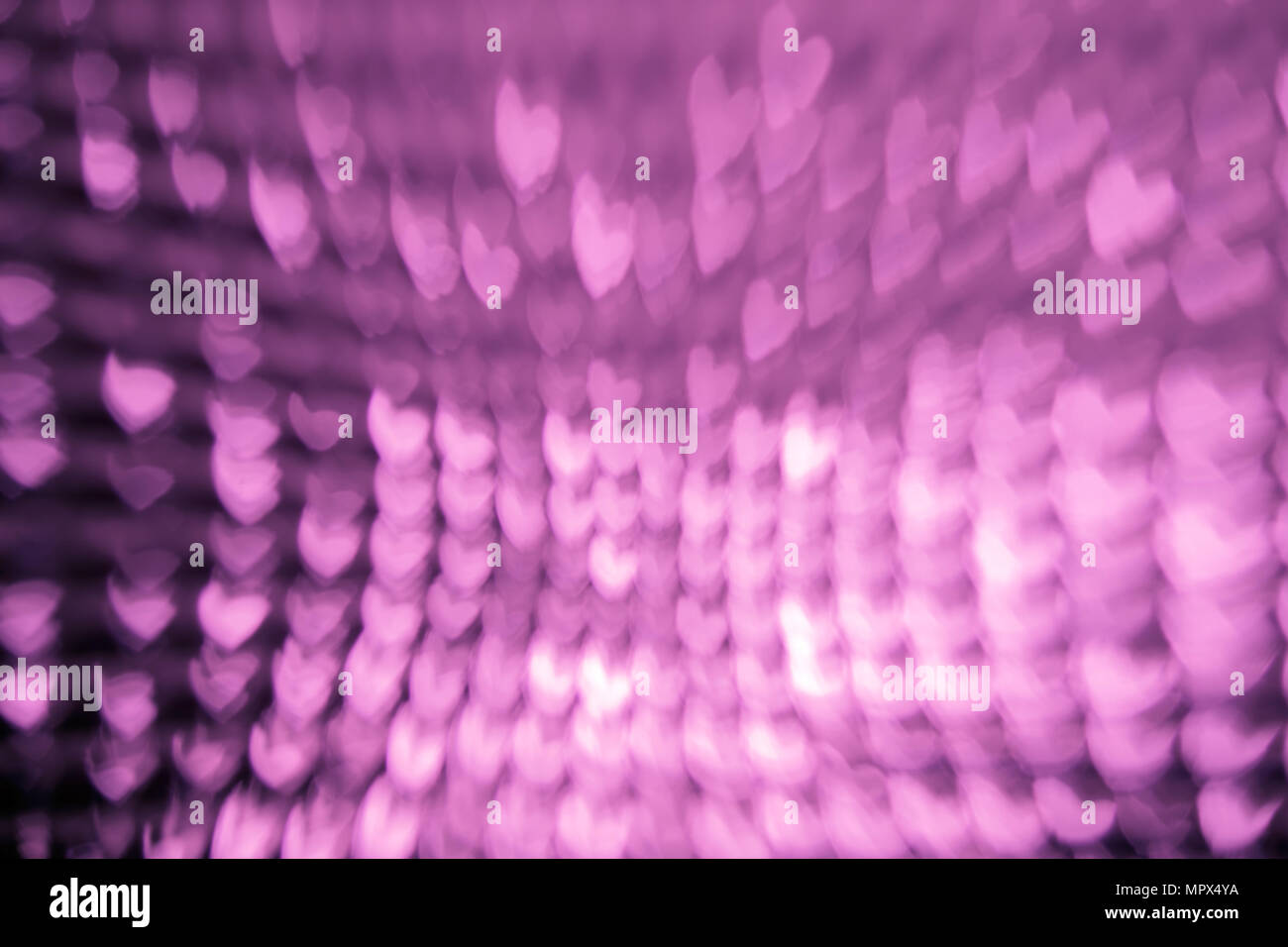 Abstract blur background with heart shaped. Violet tone. Stock Photo