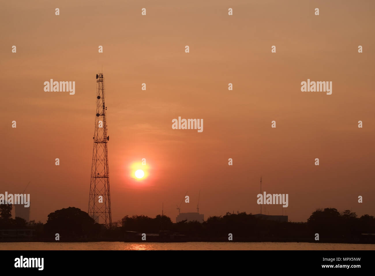 Silhouette of radio antenna tower in the morning. Stock Photo