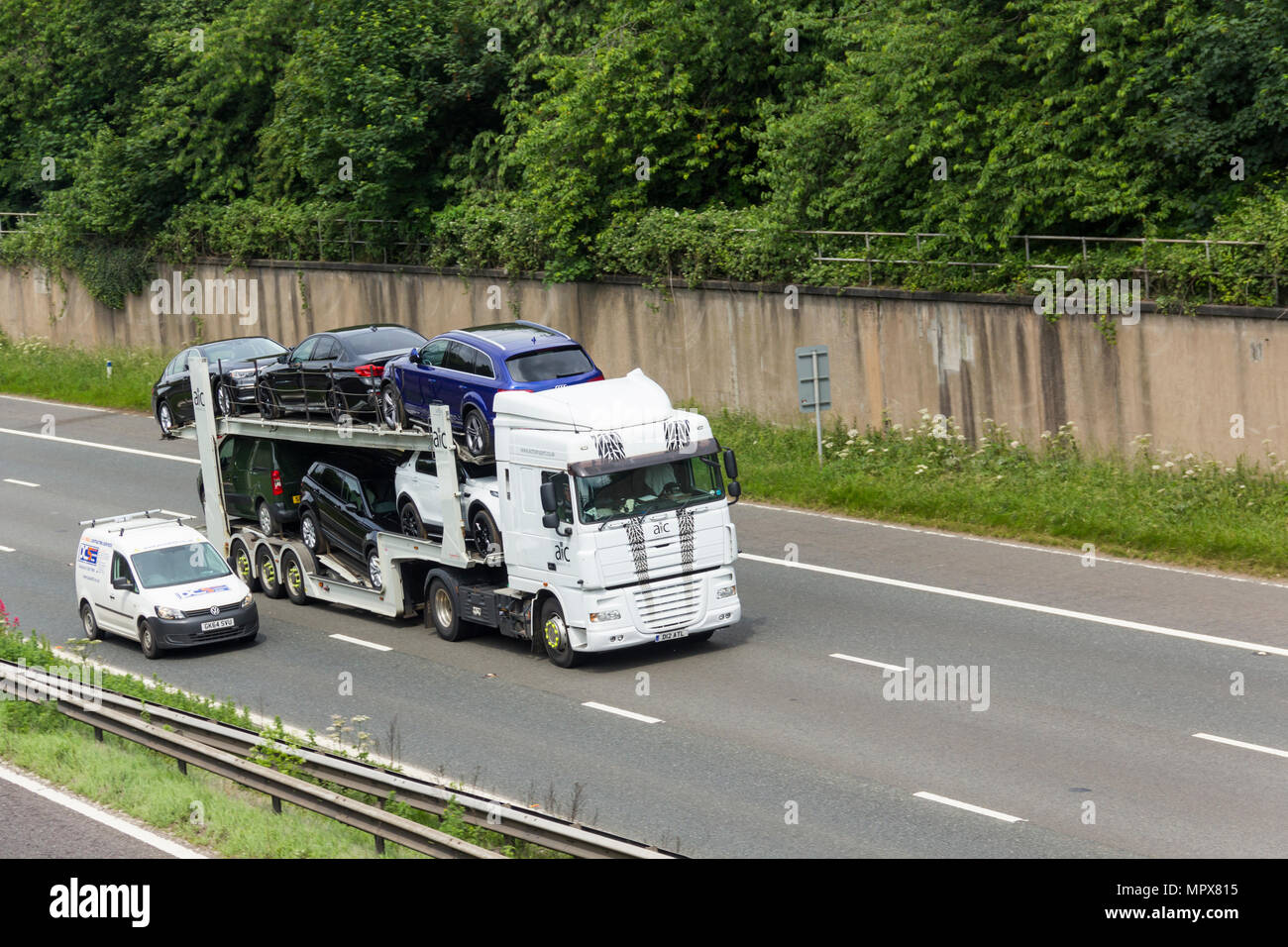 AIC Transport Ltd car transporter with Daf XF105 tractor unit travelling on the M61 motorway  near Farnworth, Stock Photo