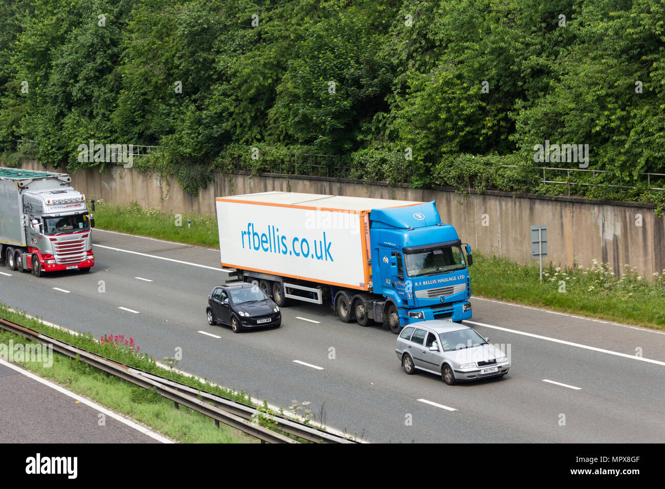 Car and HGV traffic, including a R.F Bellis Haulage Ltd articulated lorry, on the M61 near Farnworth, heading east for the M60/M62 intersection. The R Stock Photo