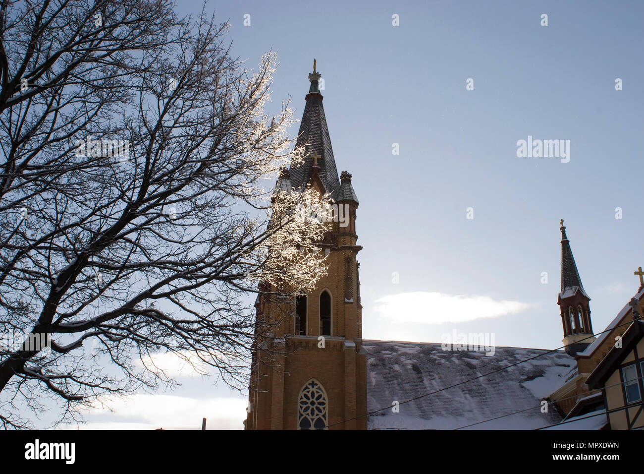 Winter view of roofline at St Stanislaus Kostka Church in Adams, MA