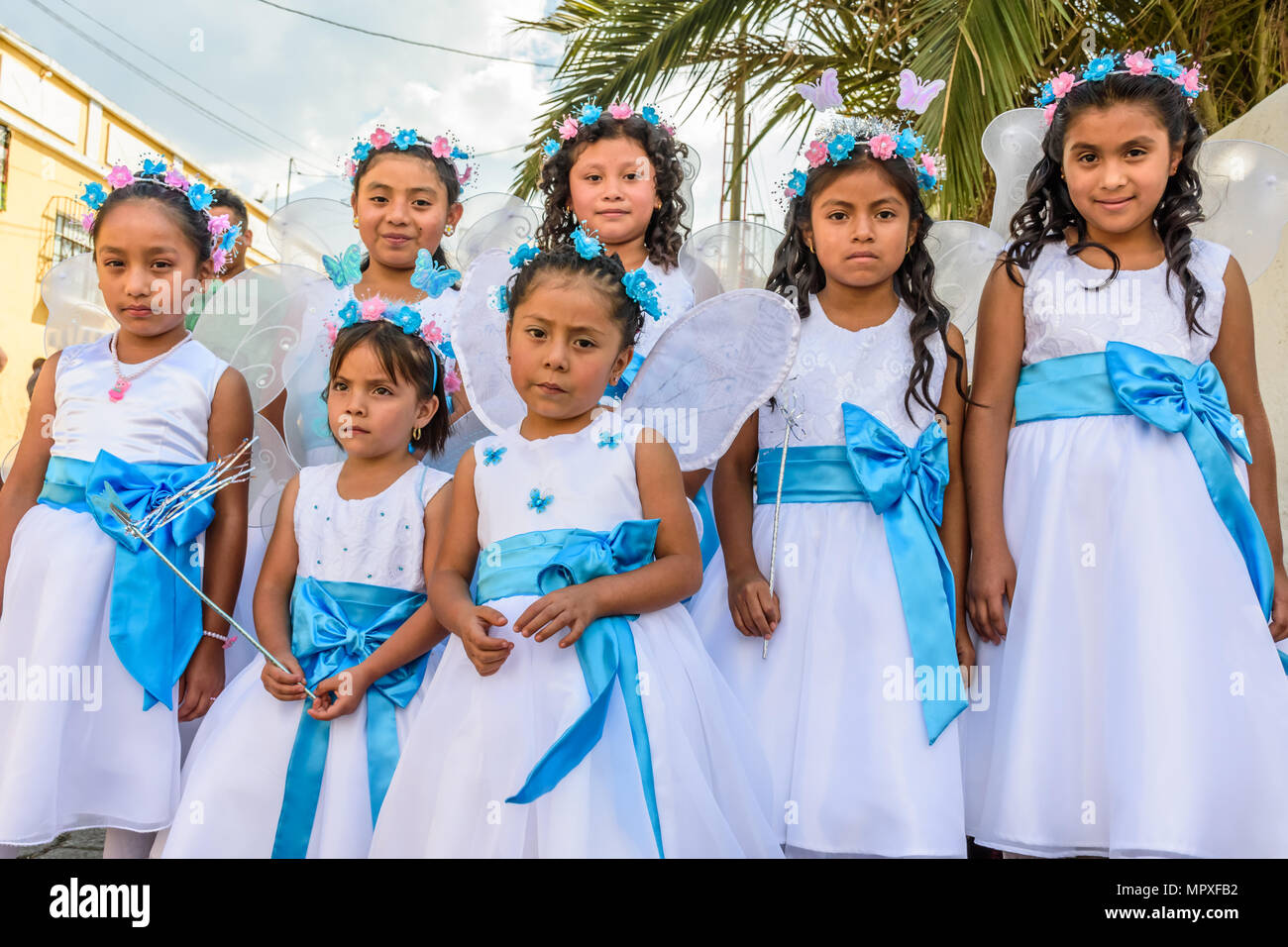 Cuidad Vieja,, Guatemala -  December 7, 2017: Girls dressed up as angels in parade celebrating Our Lady of the Immaculate Conception Day near Antigua Stock Photo