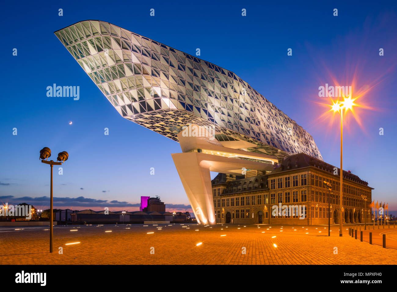 Zaha Hadid Architects, the new Port House during twilight in Antwerp