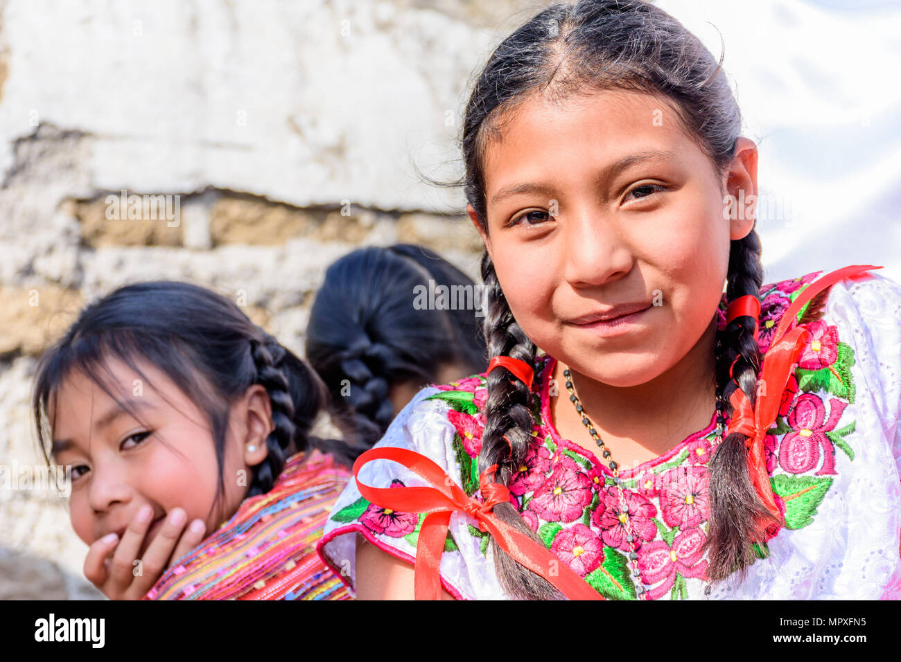 Cuidad Vieja,, Guatemala -  December 7, 2017: Traditionally dressed indigenous girls in parade celebrating Our Lady of the Immaculate Conception Day Stock Photo