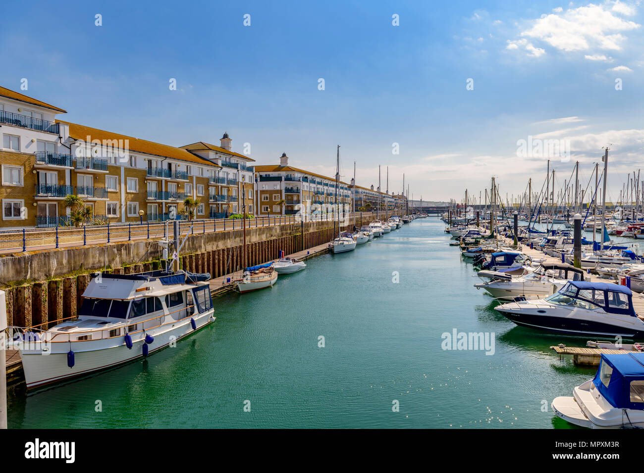 moored yachts and apartments, Brighton marina, Sussex UK Stock Photo