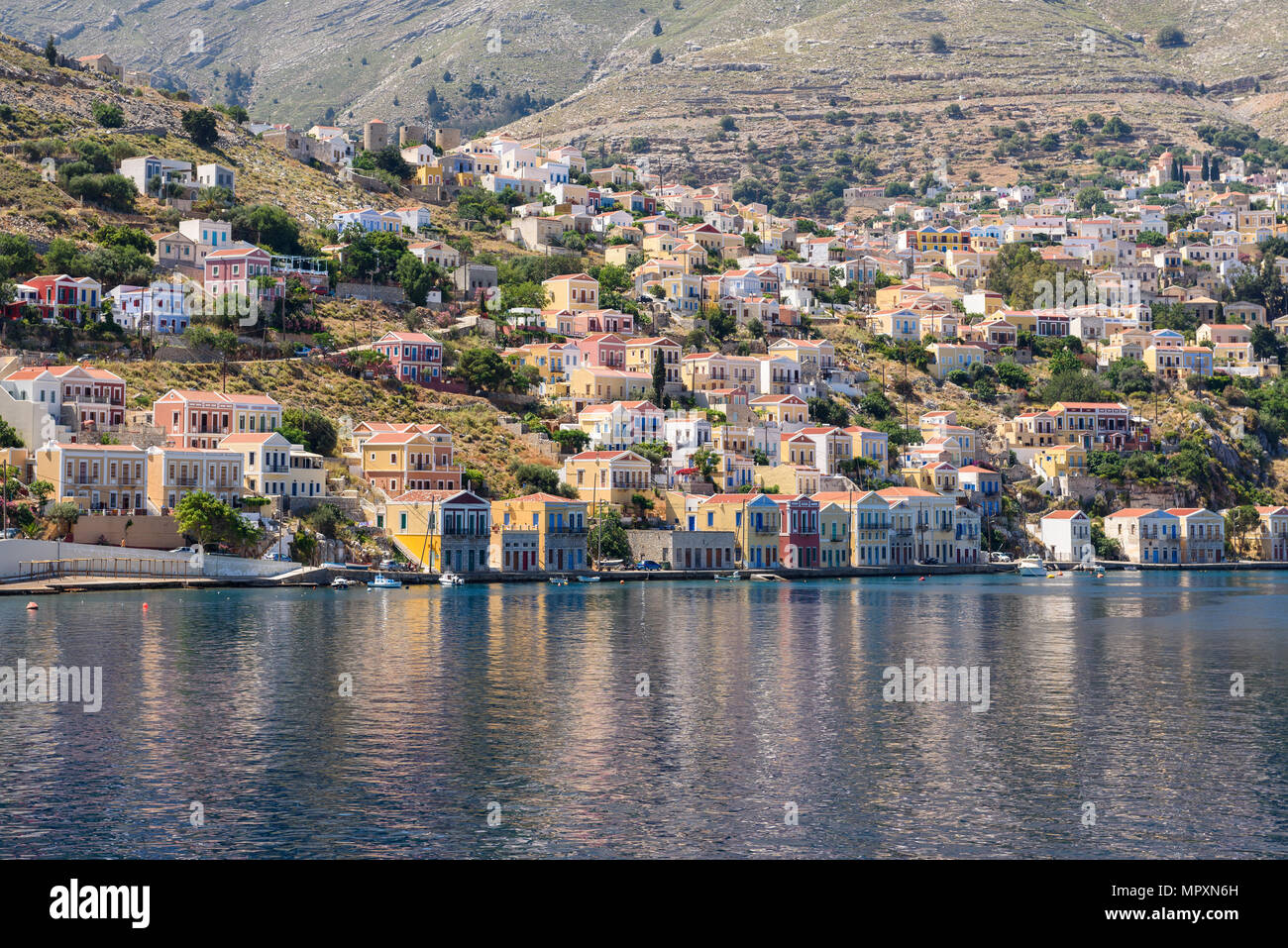 Colorful houses on the hillside of the island of symi. Greece Stock