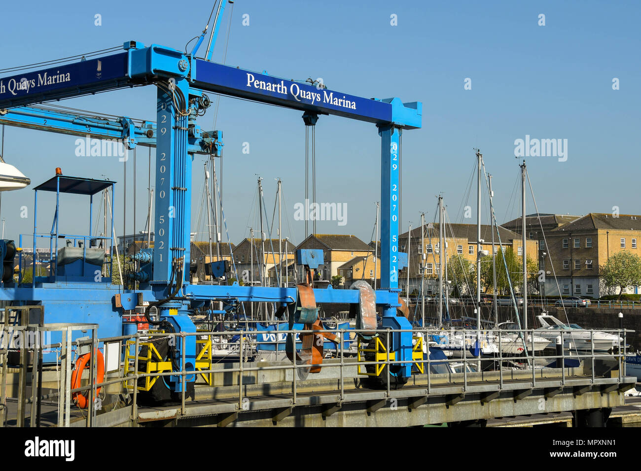 Boat lifting gantry crane on the harbour side in Penarth Quays Marina Stock Photo