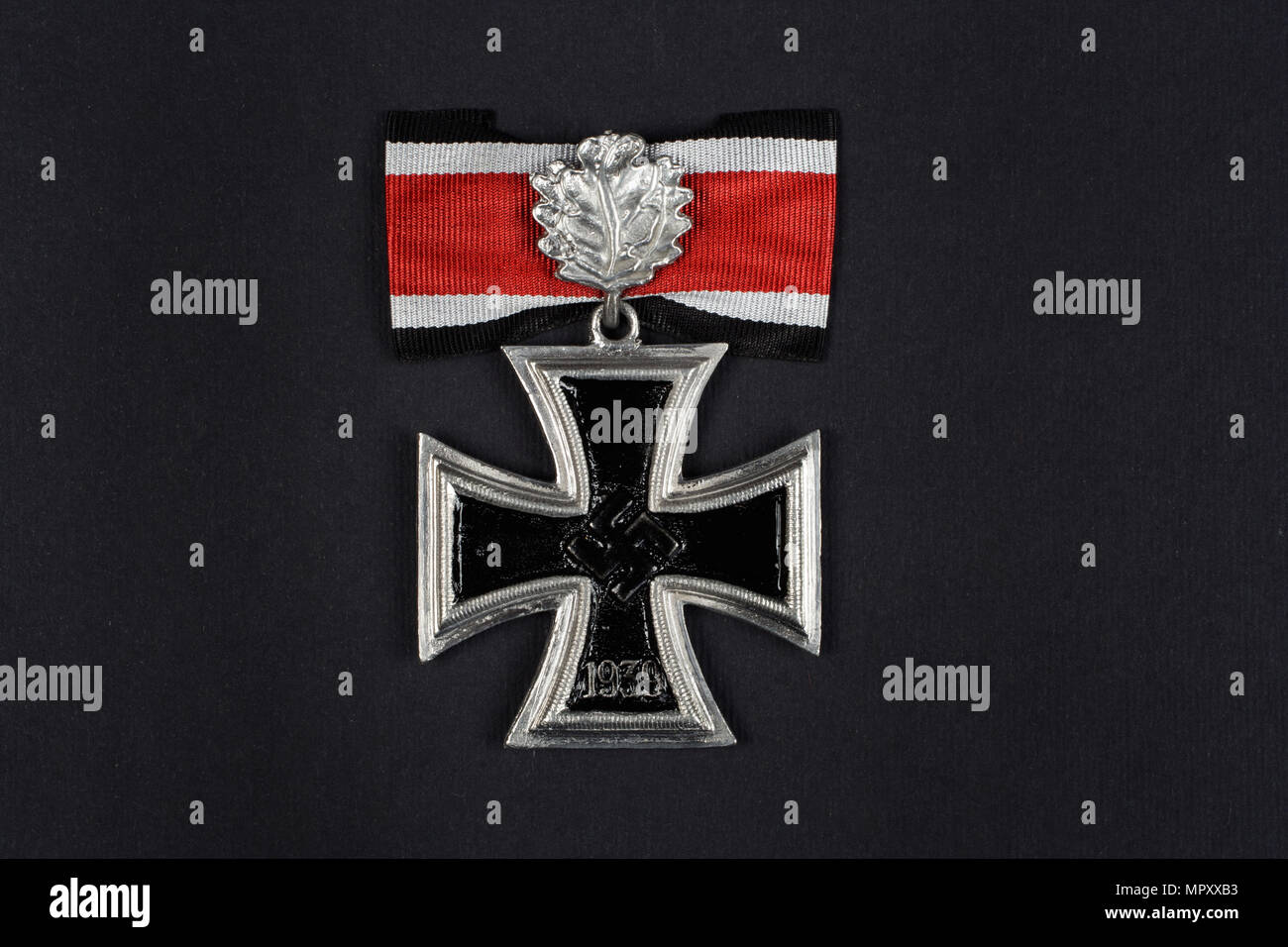 nazi german award - Iron Cross on black background Stock Photo - Alamy
