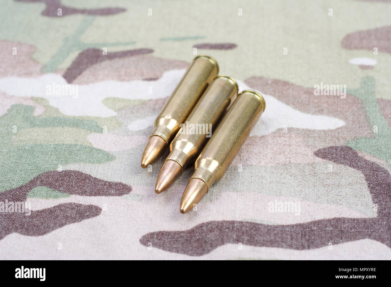 5.56mm NATO rounds on camouflage background Stock Photo - Alamy