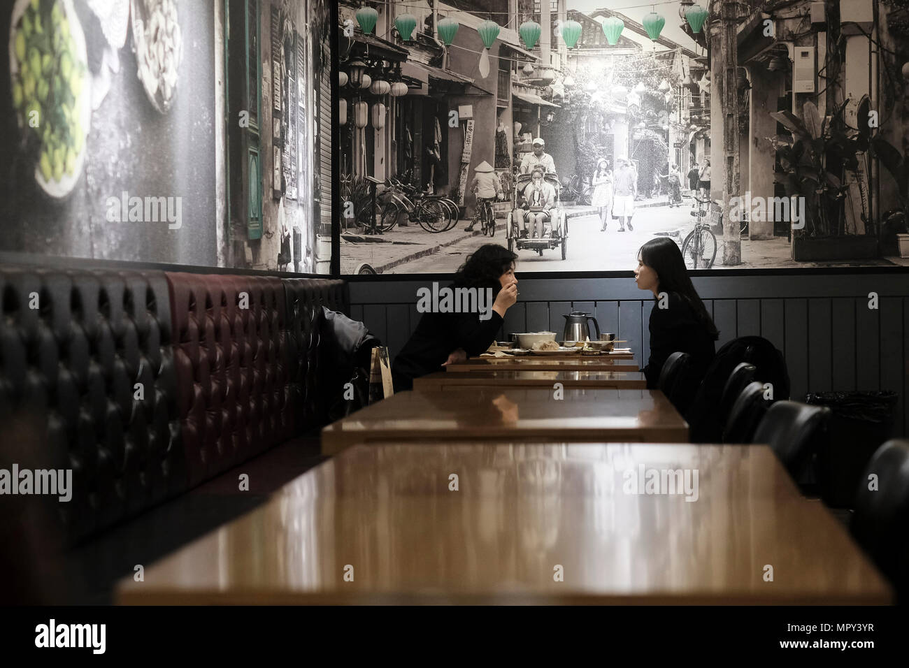 Korean women eating in Bun Cha Ra Boom restaurant which serves