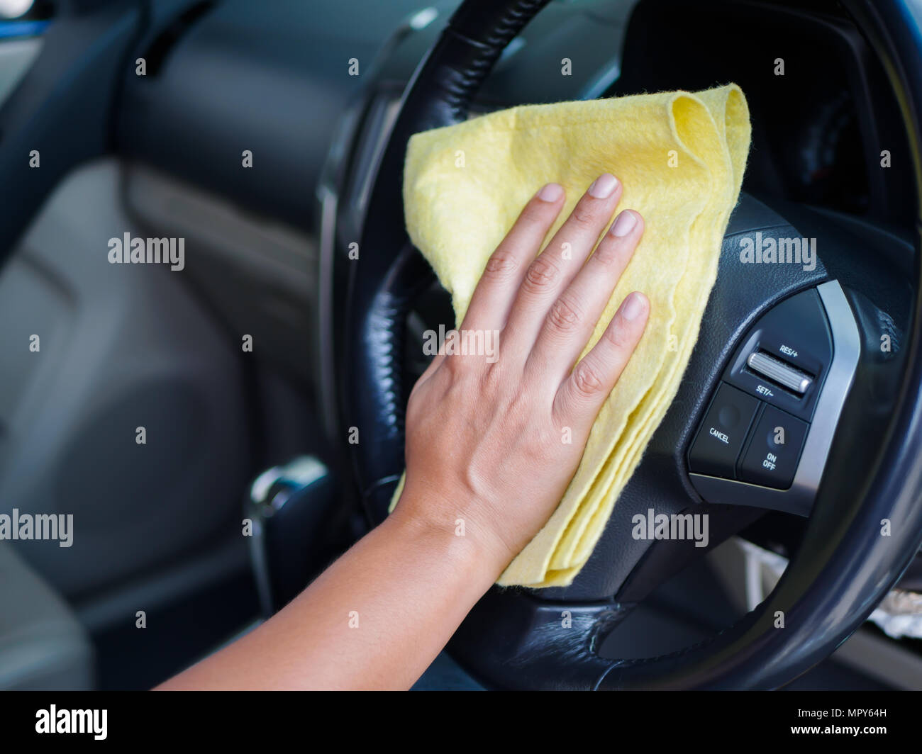 Hand Cleaning Interior Car Steering Wheel With Microfiber