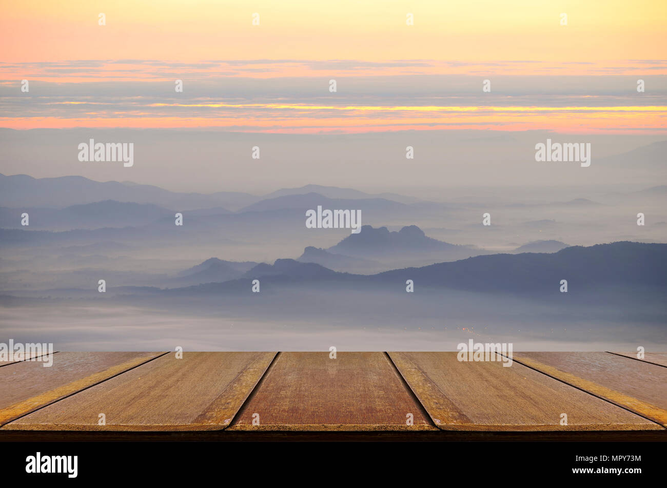 Perspective wood table with mountain and the mist view. Stock Photo