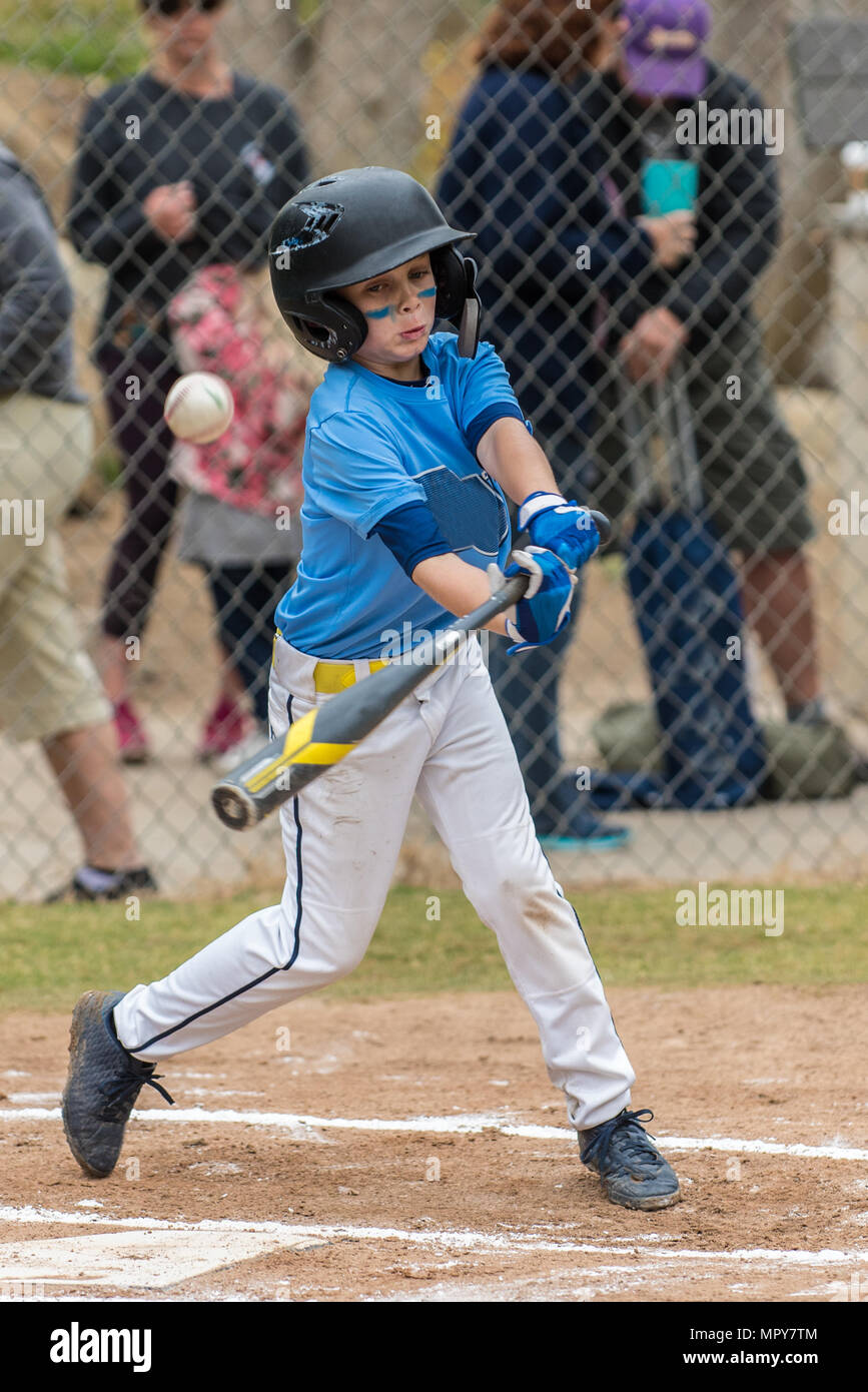 All star little league baseball player just misses the pitch and fouls ball  up in air Stock Photo - Alamy