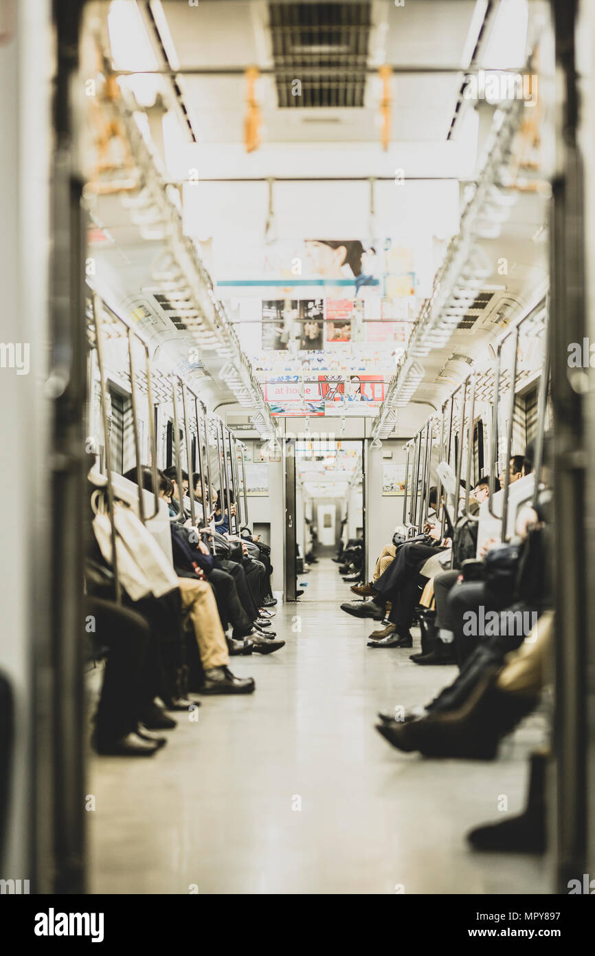 Passengers sitting in subway train Stock Photo