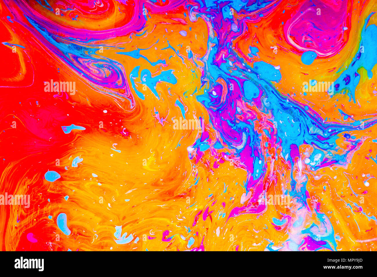 High angle view of vibrant color marbling painting Stock Photo